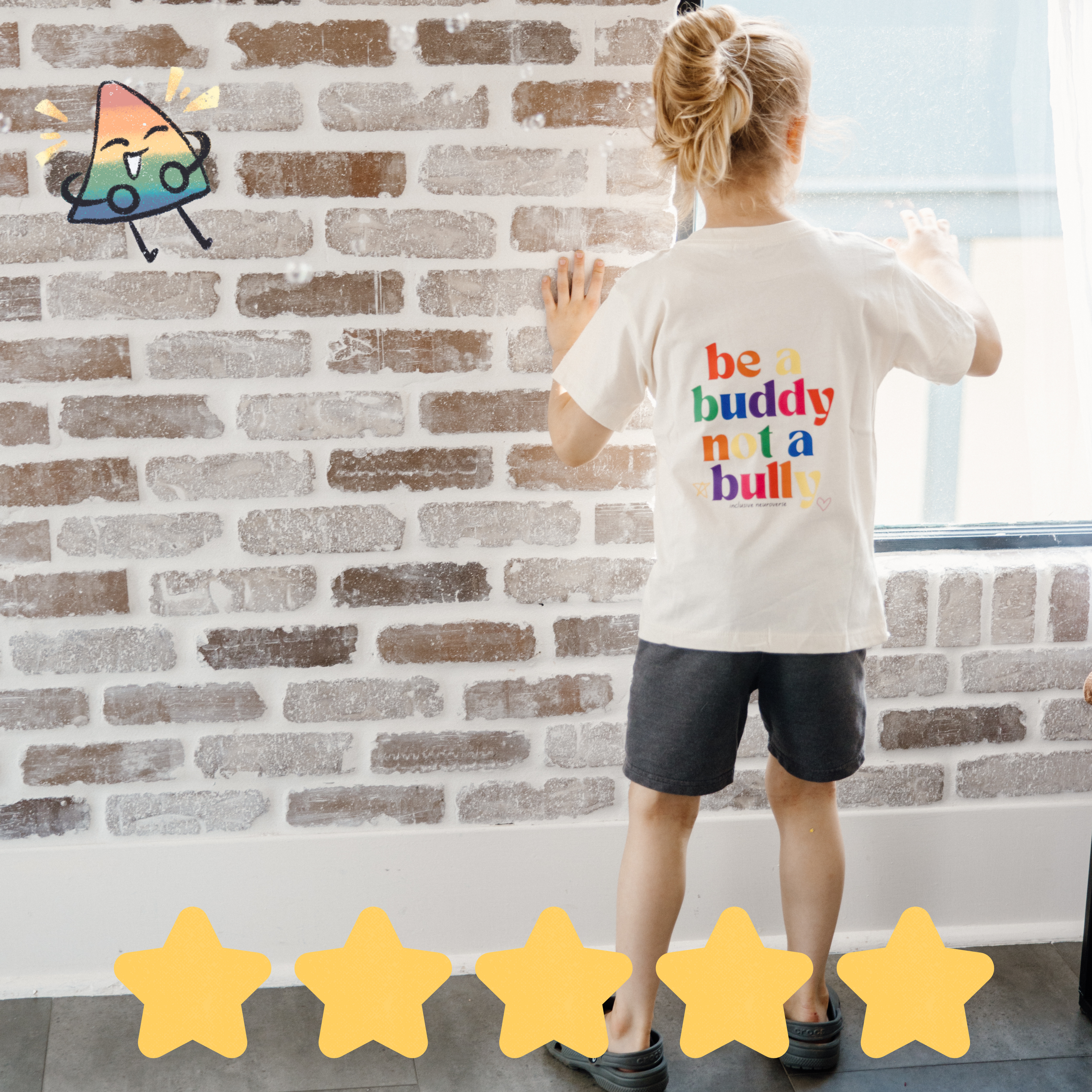 boy looking out the window with brick wall. wearing a be a buddy not a bully shirt. 5 yellow star rating.